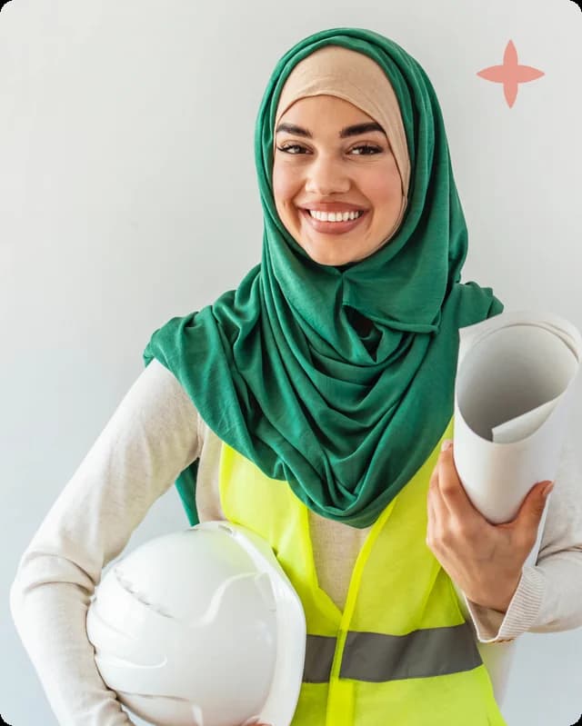 An engineer in a hijab and hi-vis, holding a hard hat and drawings